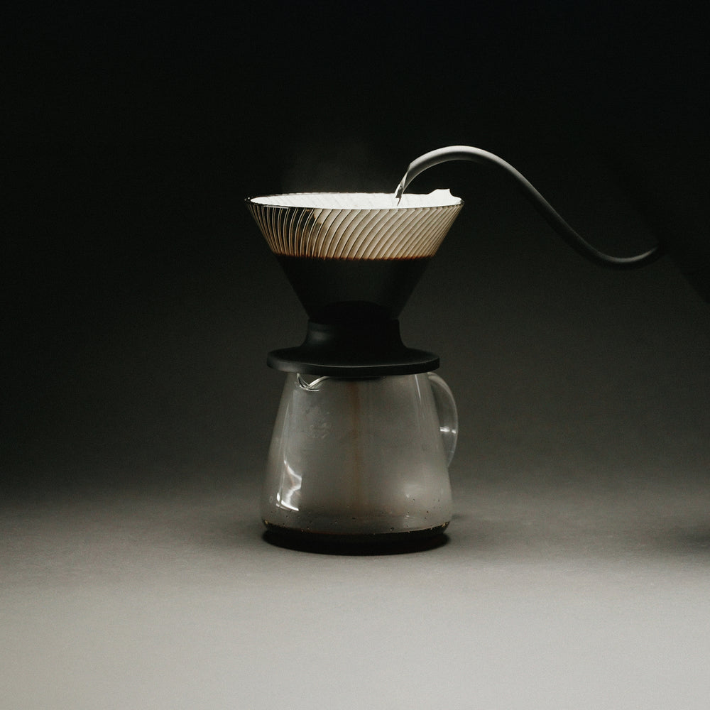Brewing pour-over coffee with the Hario V60 NEO 02 on a glass server
